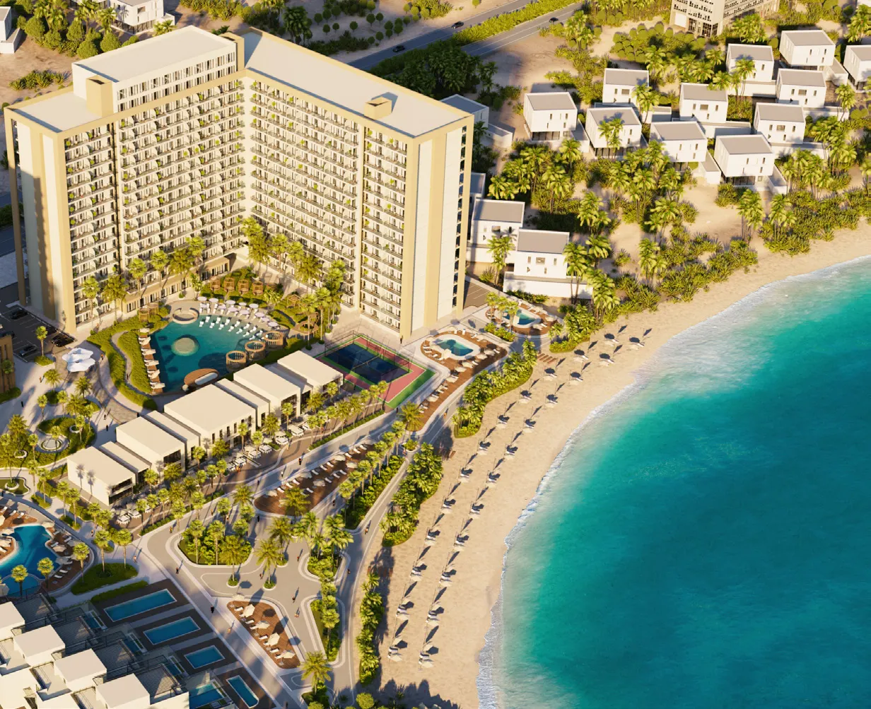 Aerial view of the pool deck, tennis court, and beach at Oceana
