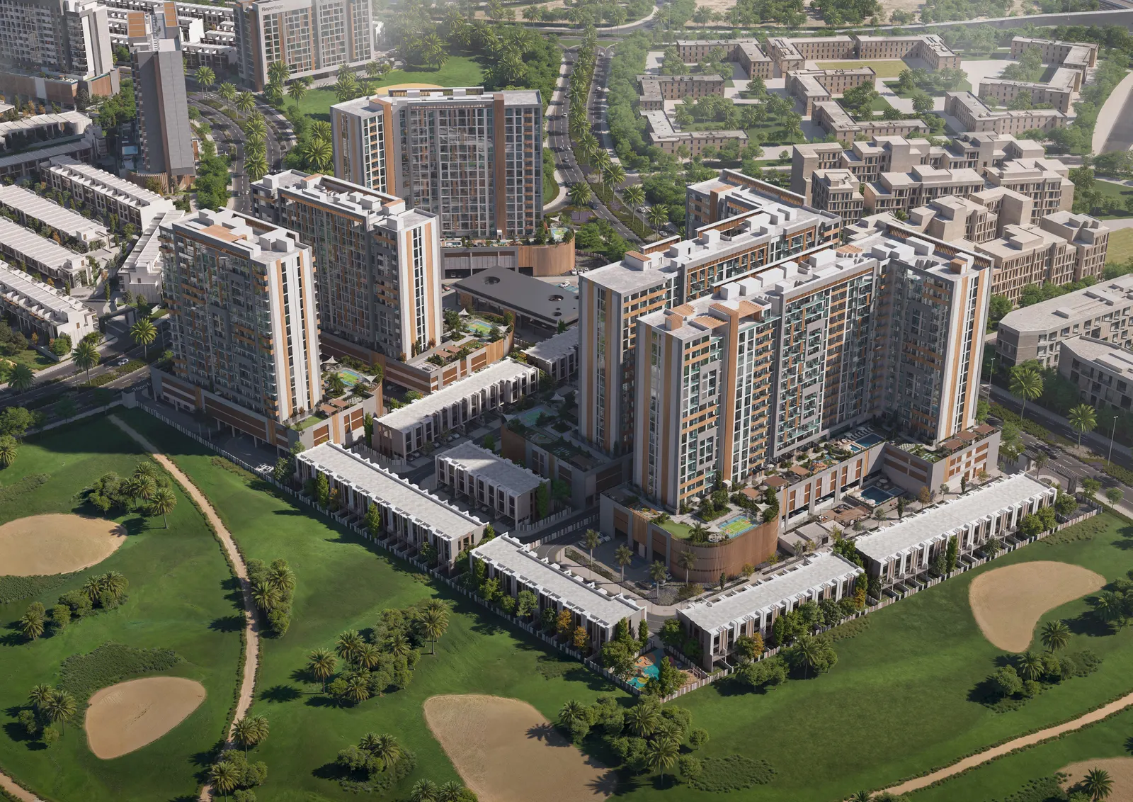 Aerial view of the Verdana towers and townhouses bordering a landscaped golf course